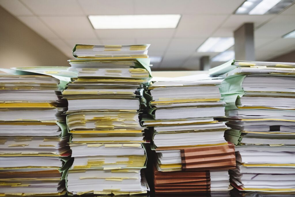 2026 freelancer tax guide a stack of files on a table messy office declutter system