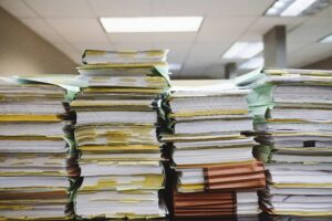 2026 freelancer tax guide a stack of files on a table messy office declutter system