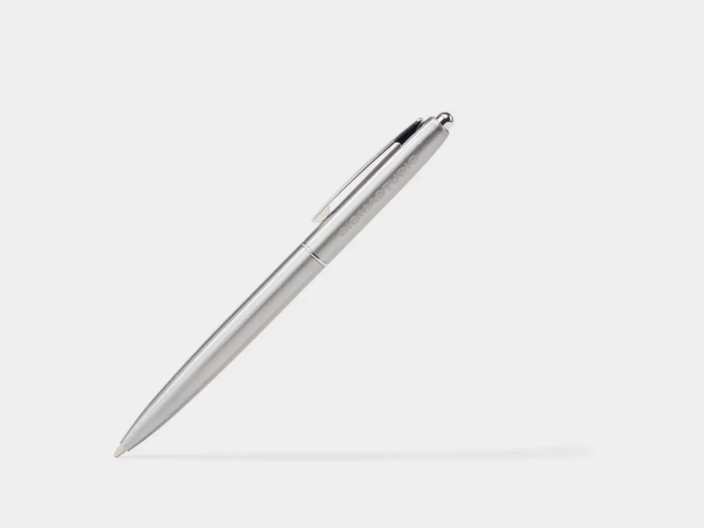 a silver pen on a white background