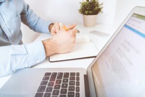 Quarterly Tax Checklist business man on laptop When Should You Incorporate Your Business?