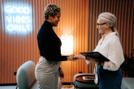 Woman in Black Long Sleeve Shirt Had a Job Interview - LinkedIn Job Posting Cost