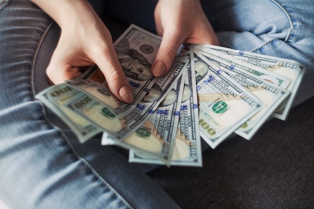 Person Holding 100 Us Dollar Banknotes - er tech jobs