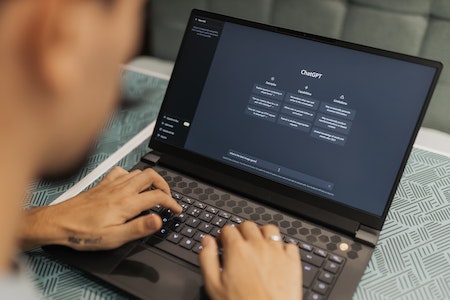 Man using ChatGPT on laptop - professional training courses