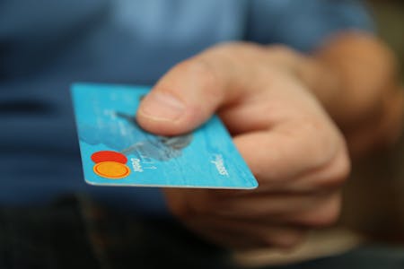 debt-to-equity ratios man with credit card