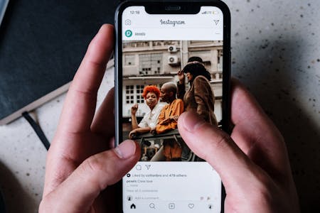 automate business during the holiday season person looking at Instagram