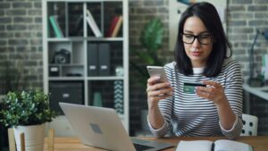 woman making a payment - How to Optimize Payment Terms