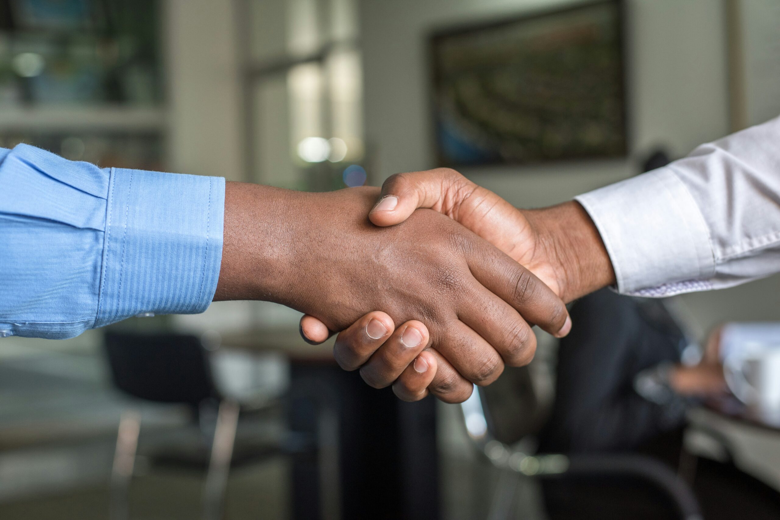 business deal shaking hands reducing time-to-hire