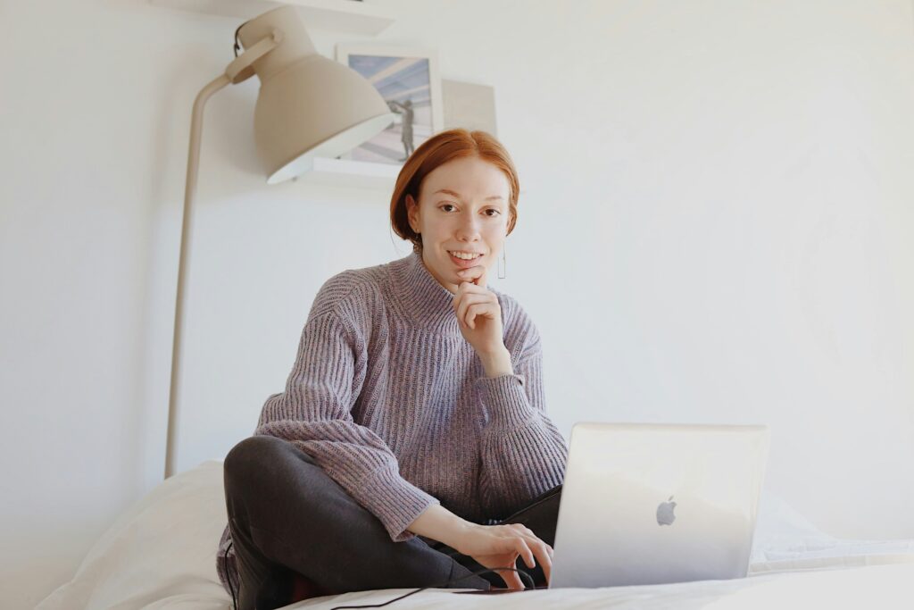 woman working on laptop Transitioning from Freelancer to Firm