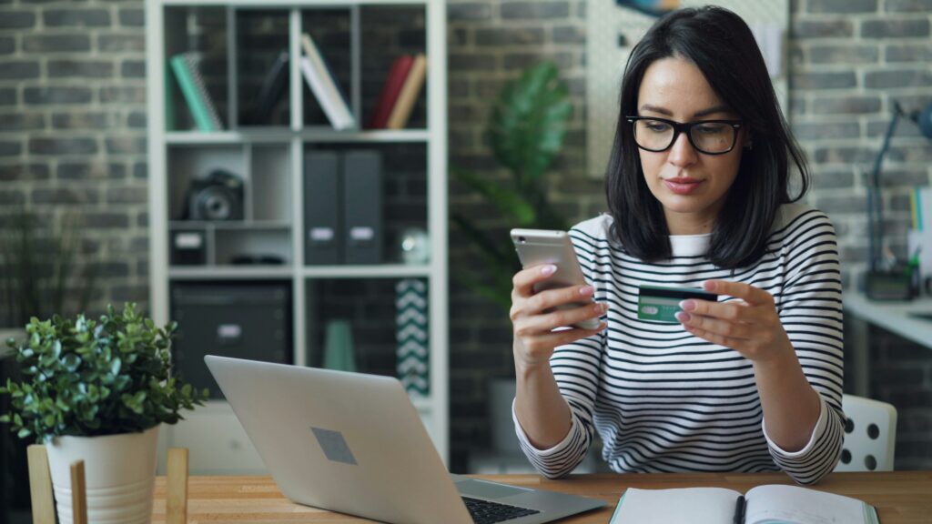 woman paying something with a credit card How to Start an LLC in 2026