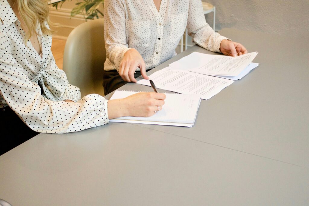 How to Prepare for a Business Audit businesswoman doing taxes Business Line of Credit vs Business Loan