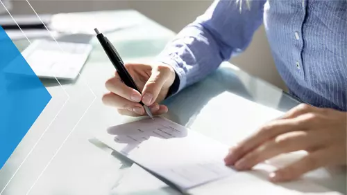 man writing a check