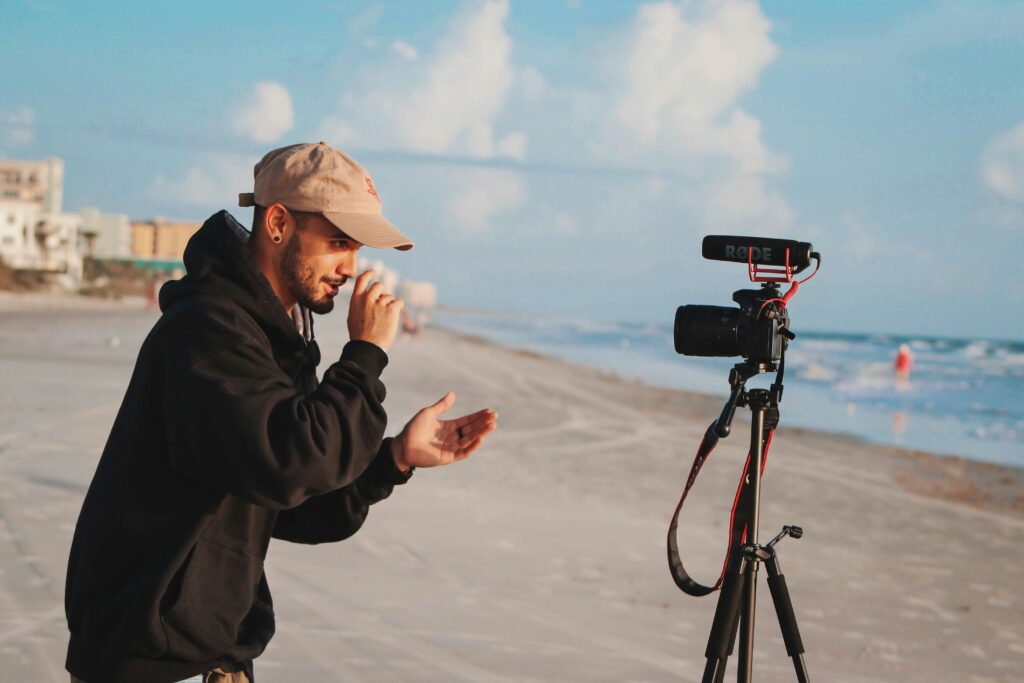 content creation man on video camera side hustles for professionals
