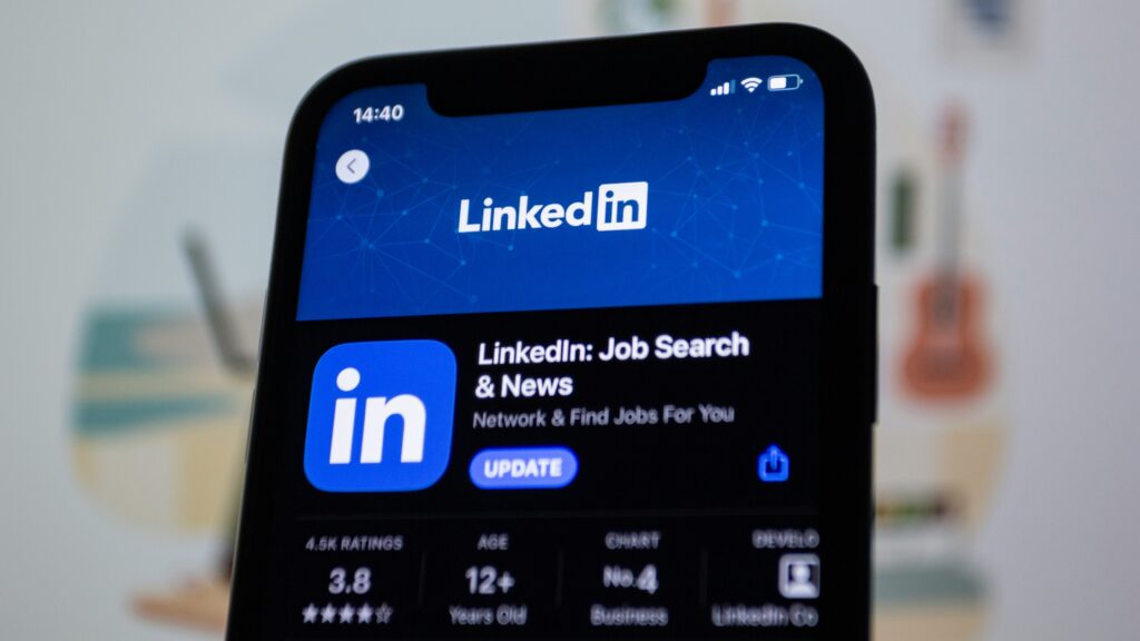 LinkedIn app on smartphone screen build a personal brand on linkedin