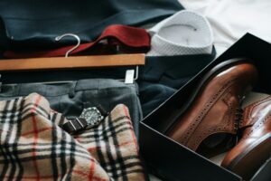Elegant clothing and accessories laid out professional capsule wardrobe for work