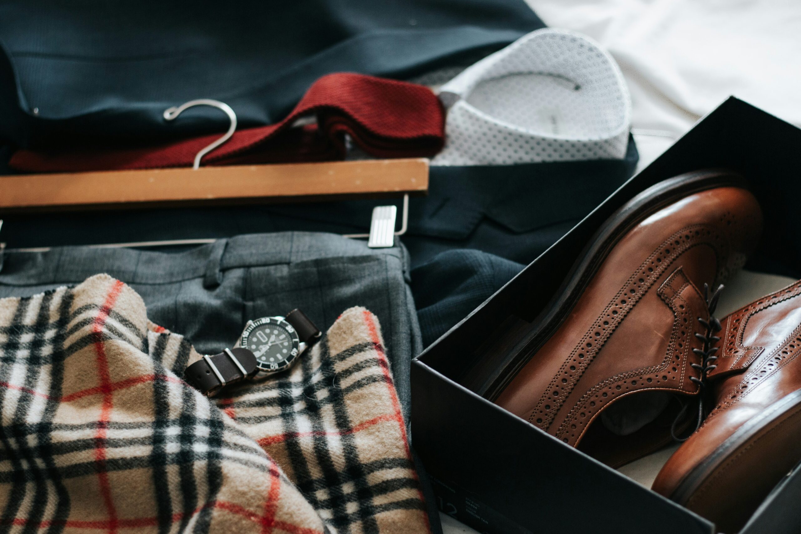 Elegant clothing and accessories laid out professional capsule wardrobe for work
