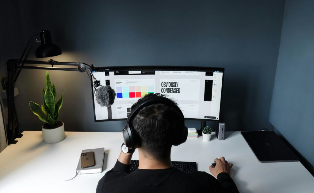 man designing something on website for brand how to build a brand identity for small business