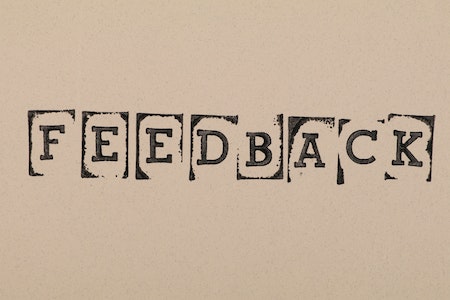 Close Up Photo of Stamped Text - ways to use chatbot for business