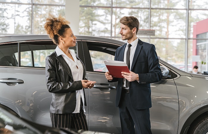 woman buying a car - buying a car for the first time