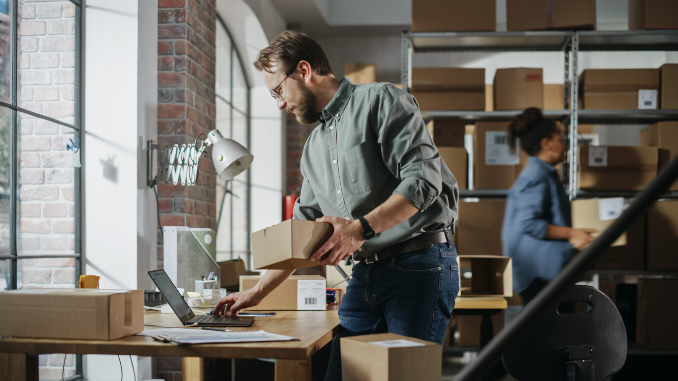 set up a shipping station Busy Day at Warehouse. Multicultural Employees at Work in Retail Shop's Storeroom. Small Business Owners Working on Laptop, Preparing and Packing Parcels for Delivery. create a portfolio website