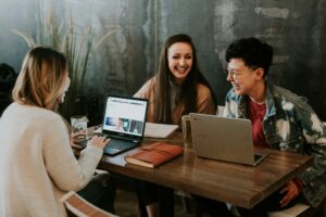 Small Business Cost Saving Hacks - workers laughing