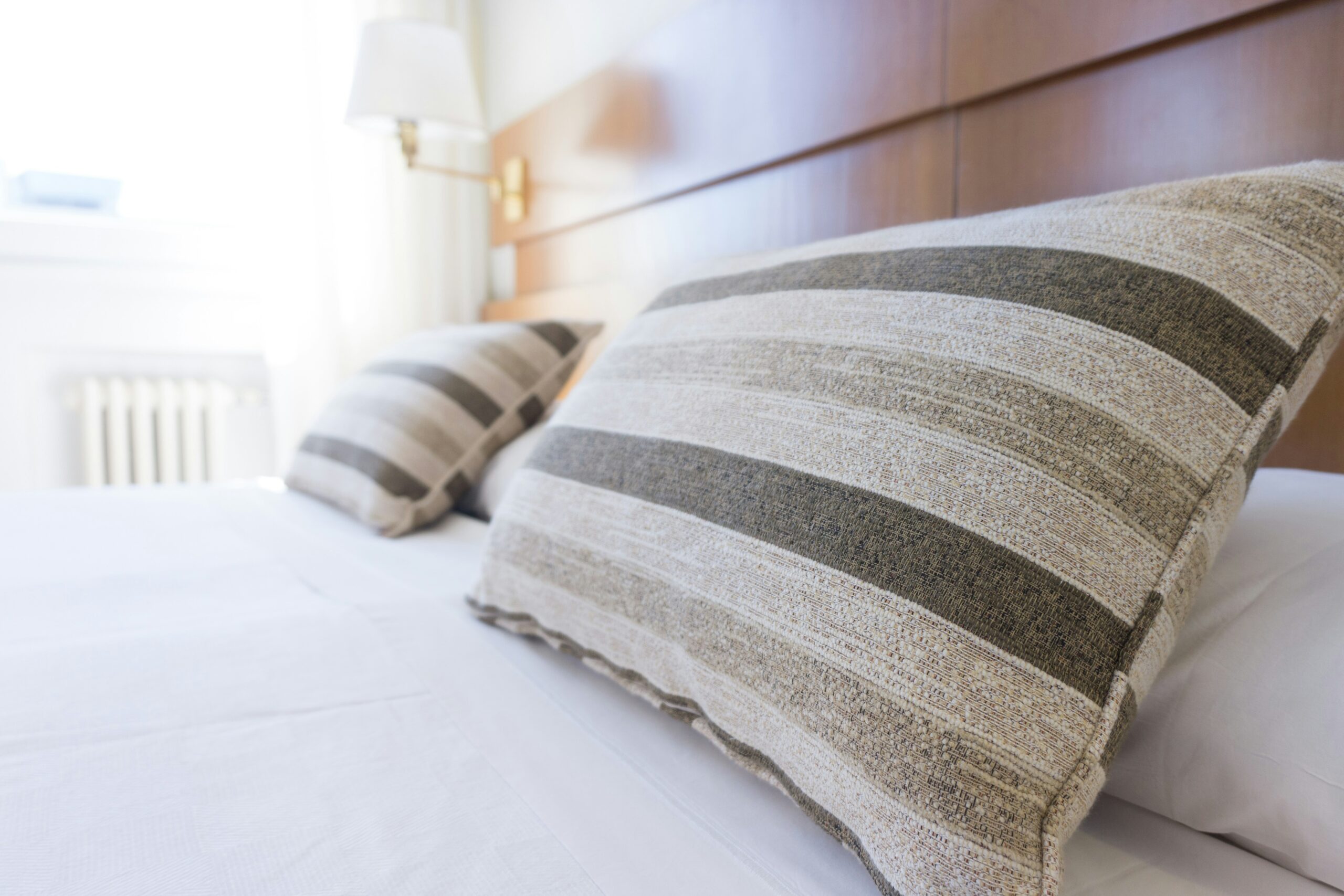 Short Term Rental Supplies - pillows on bed