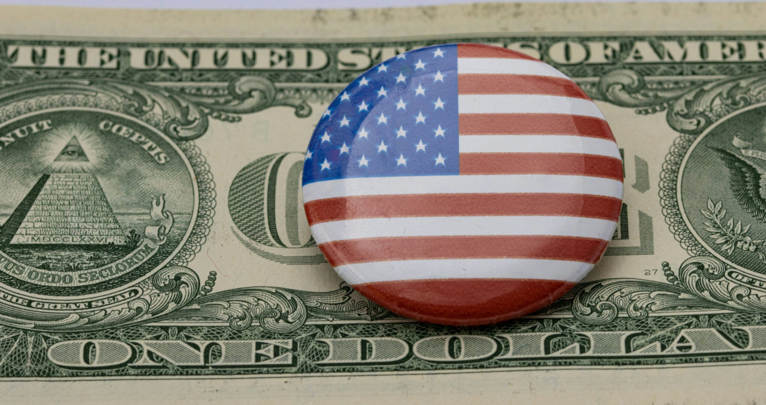 how will tariffs impact us - flag on money
