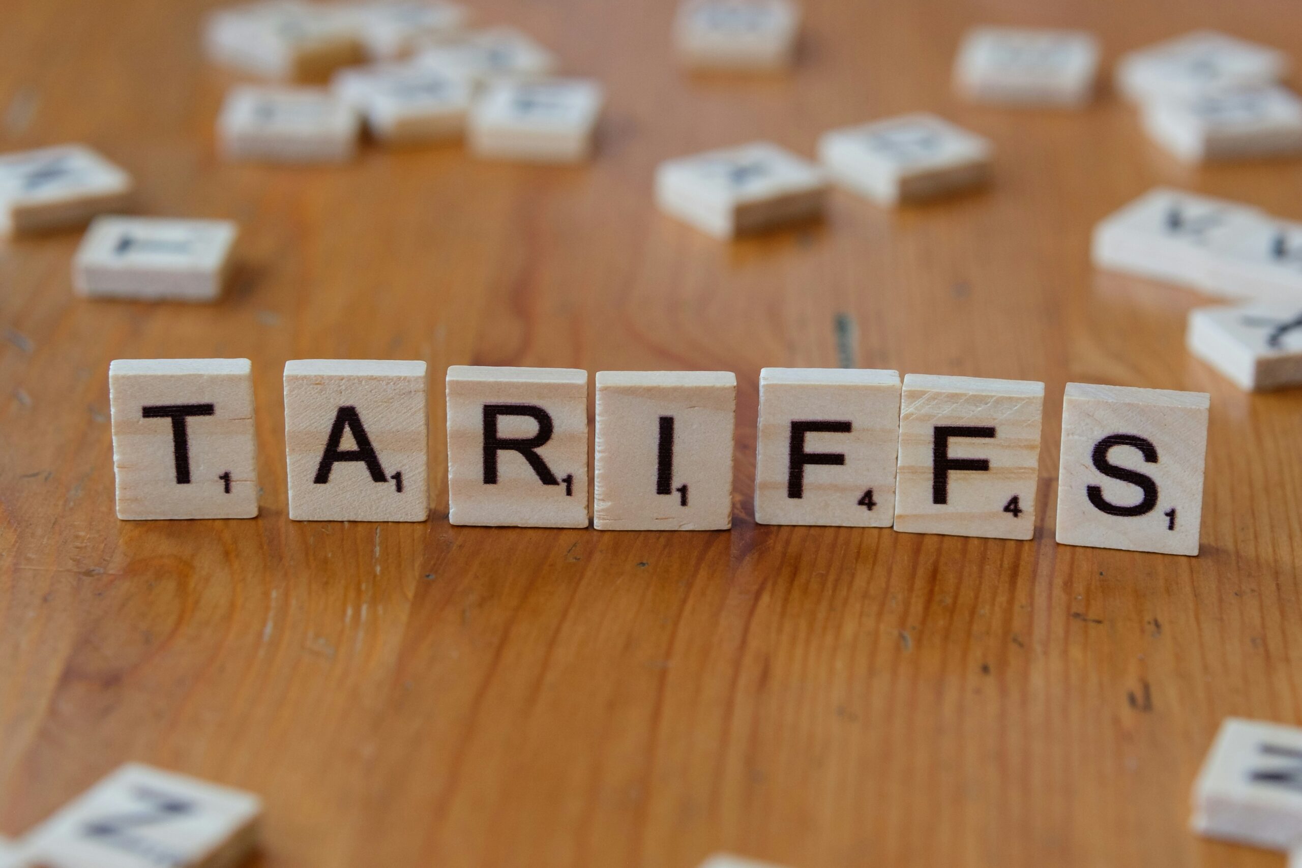 how will tariffs impact us - scrabble letters
