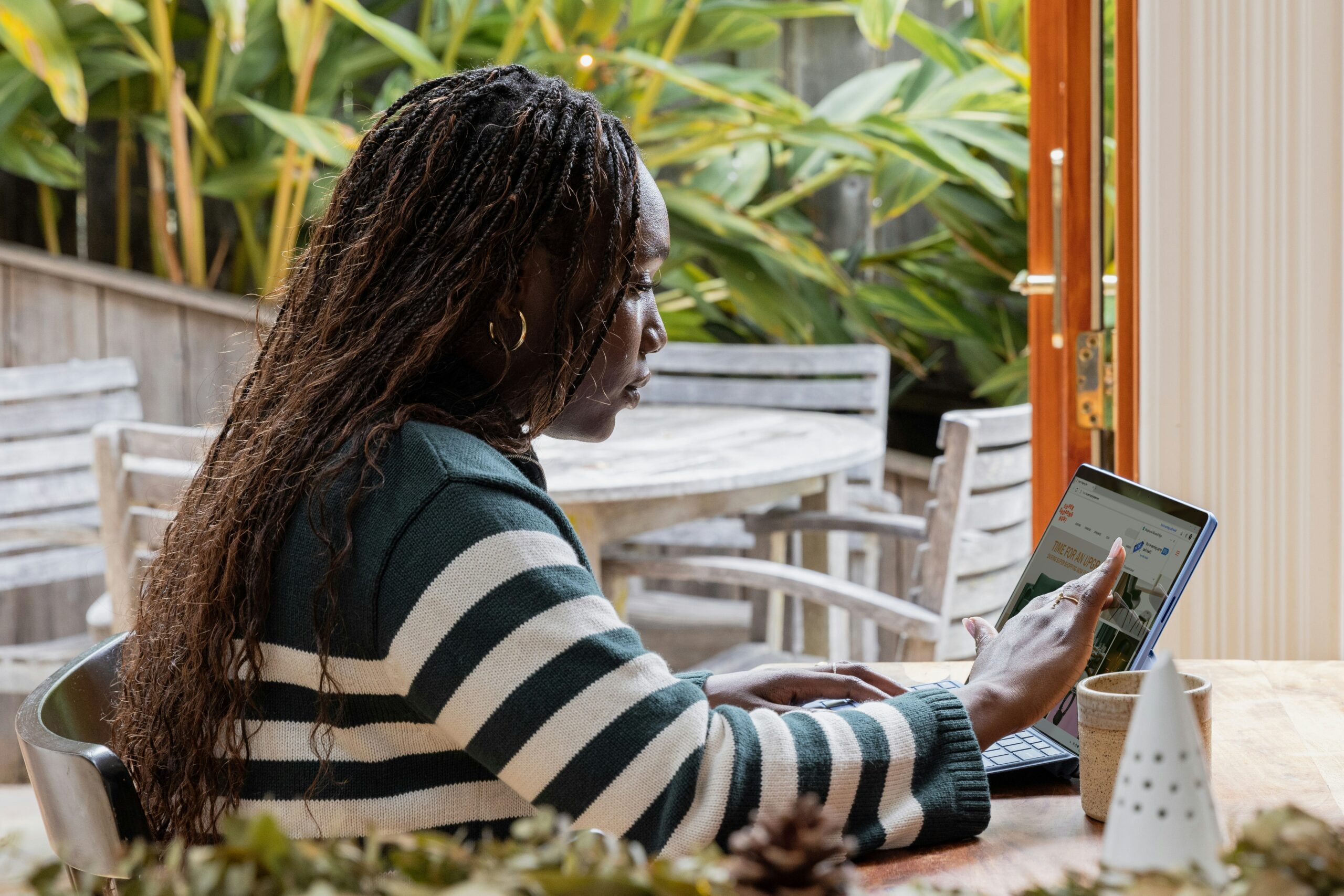 how to make your business look high quality - woman on laptop